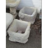 A pair of reconstituted stone garden planters, each square shaped with ivy leaf detail, 26cm high,