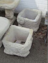 A pair of reconstituted stone garden planters, each square shaped with ivy leaf detail, 26cm high,