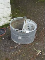 A galvanised mop bucket.