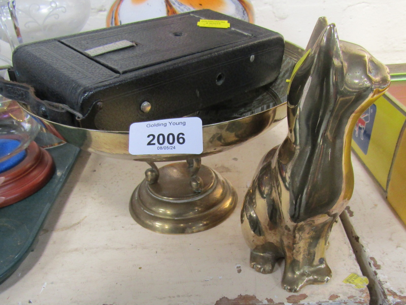 An Ensign camera, a willow pattern brass rose bowl, and a brass cat. (3)