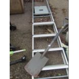A bath step ladder and shovel.