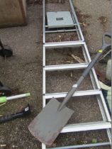 A bath step ladder and shovel.
