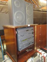 A teak hi-fi cabinet and Sanyo hi-fi system, with speakers.