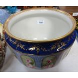 A 20thC planter, with a gilded border, on a Royal blue rose transfer printed ground.