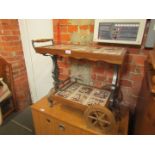 An oak and tile top two tier cocktail trolley, various scenes including blacksmiths, etc.