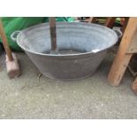 A galvanised dolly tub, with two handles.