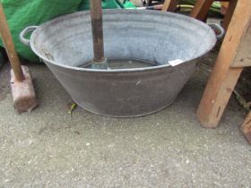 A galvanised dolly tub, with two handles.