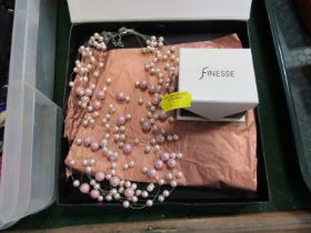 A pair of Finesse pink lustre finish stud earrings, and a five strand pearl effect necklace.