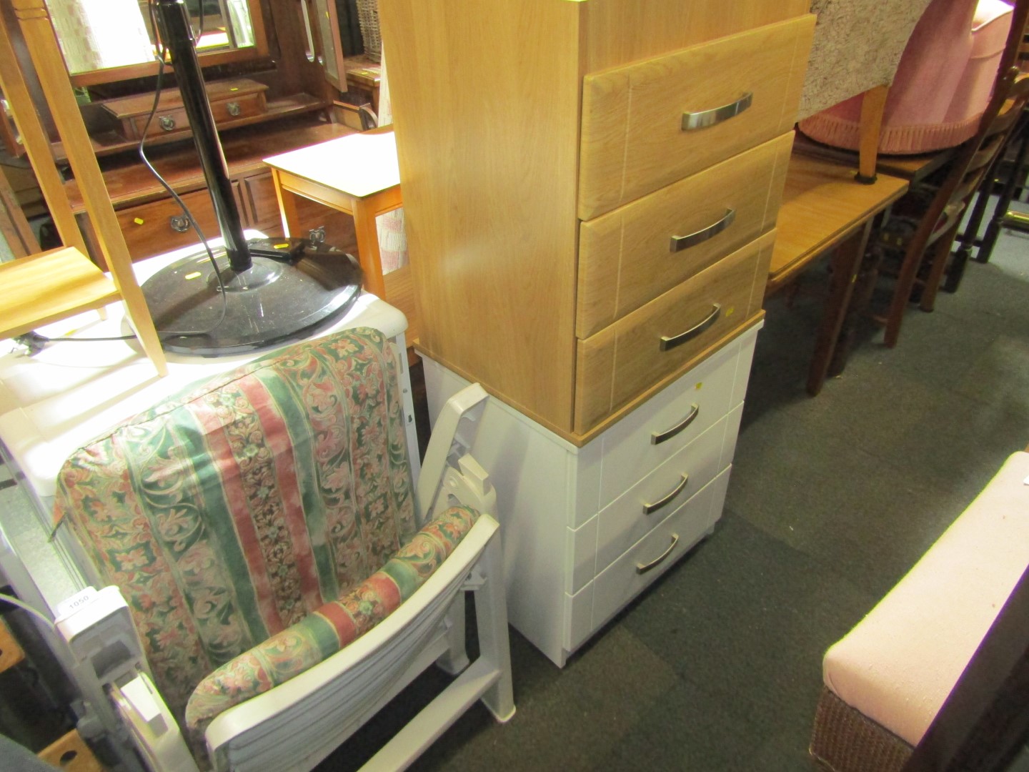 Two three drawer bedsides, comprising one beech effect and one white, and a folding deck chair. (3)