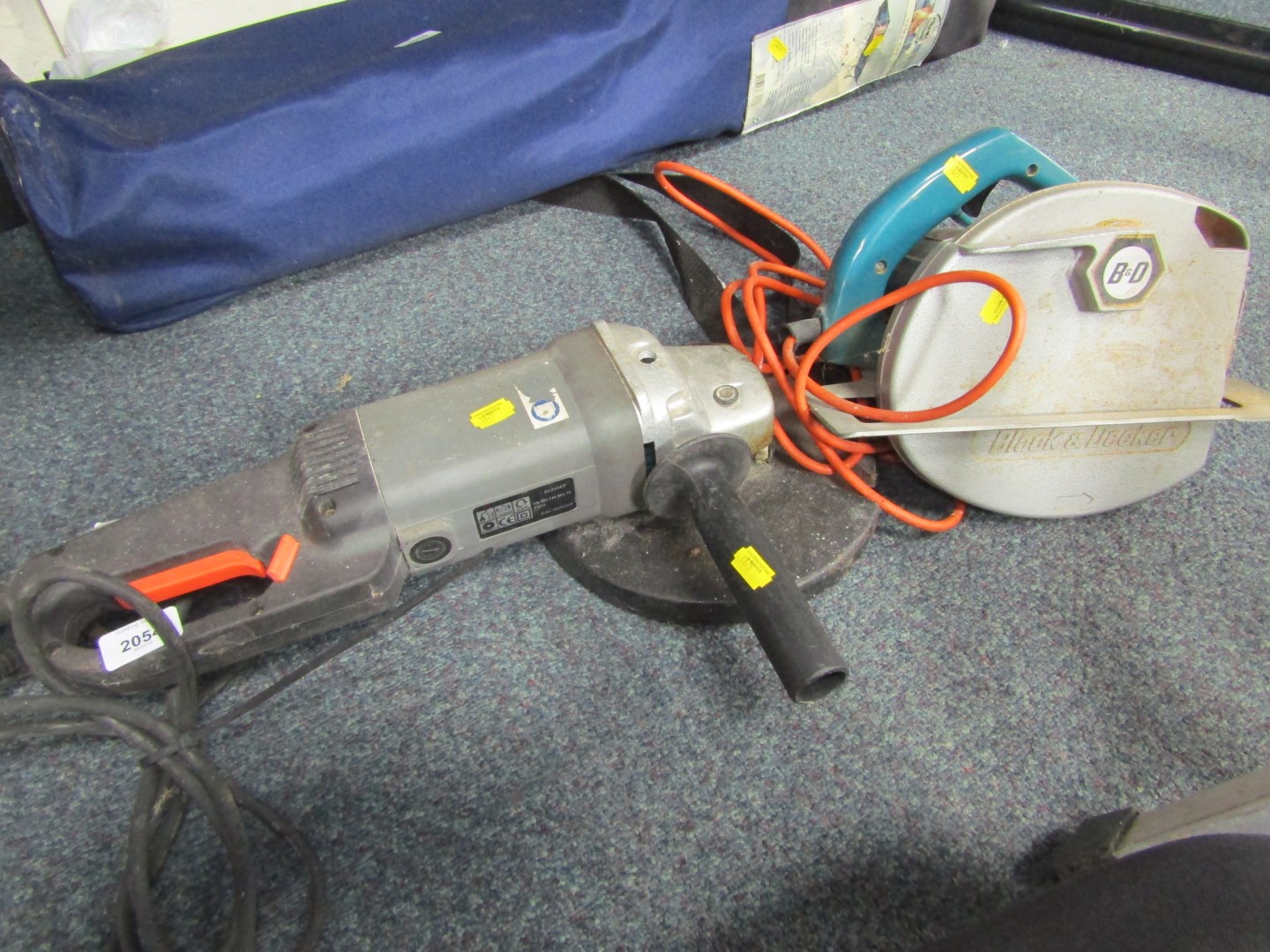 A Kinzo angle grinder, and a Black and Decker circular saw.