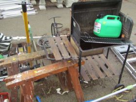 Four pine trestle stands, petrol can and a barbecue.