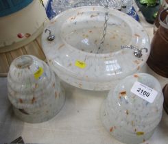 A set of 1970s/80s ceiling lights, on a white mottled and orange specked ground, comprising