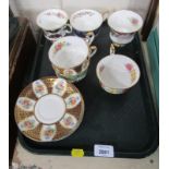 Paragon china cups and saucers, each florally and gilt decorated and transfer printed with flowers.
