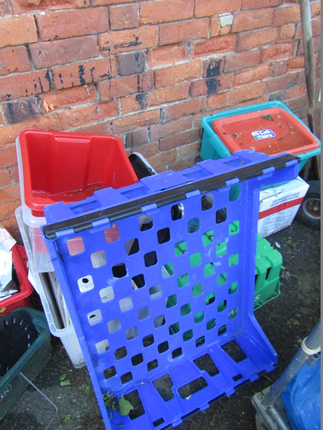 A quantity of plastic boxed and crates.