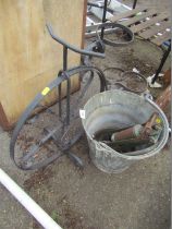 A galvanised bucket, foot pump, wheelbarrow planter. (3)