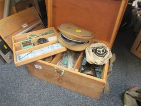 Two wooden fishing boxes, and contents of reels and spools.