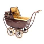A vintage doll's pram, steel framed with cream and brown painted decoration, 68cm high, 87cm wide.