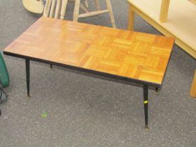 A retro style coffee table, with striped box top, on ebonised painted legs.