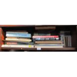 Books on motor racing, etc., and music CDs. (1 shelf)