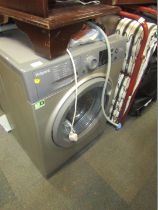 A Hotpoint grey finish washing machine.