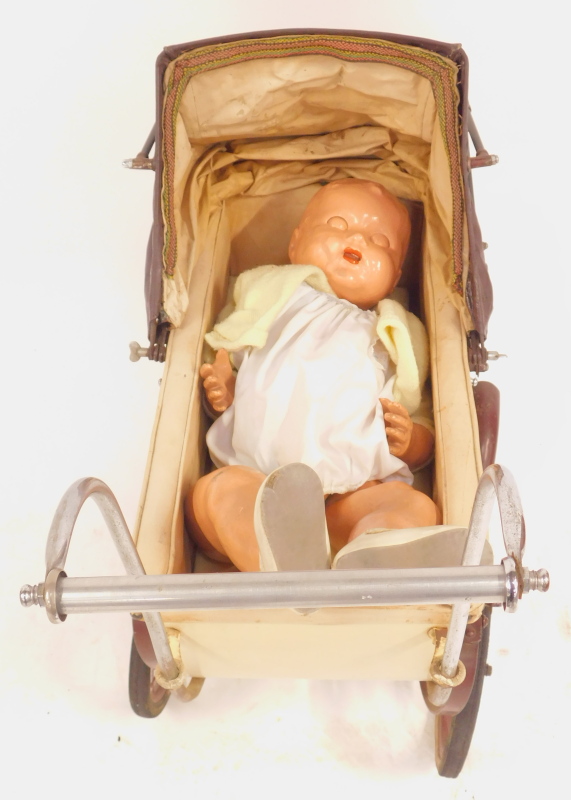 A vintage doll's pram, steel framed with cream and brown painted decoration, and a painted papier - Image 2 of 5