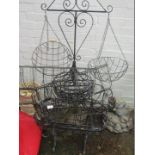Various wrought hanging baskets and planters.