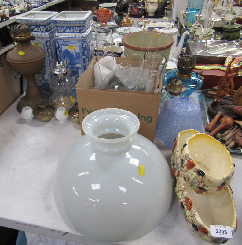 Various oil lamp funnels, glass shades, bases, a pair of Oriental style modern vases, Sylvac