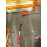 A Flymo cordless hedge trimmer, with battery.