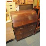 A 20thC oak bureau, with fall flap above an arrangement of two short and two long drawers, with