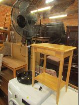 A black pedestal fan, with a remote, and an oak side table. (2)