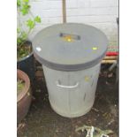 A galvanised bin, with rubber lid.