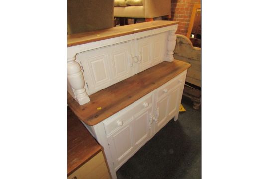 A painted oak dresser, the two cupboard top above arrangement of two drawers and two cupboards, on