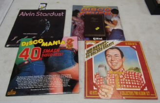 A small group of records, to include Jim Reeves, Disco Mania, Alvin Stardust, and a telephone and