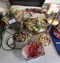 A collection of brassware, comprising brass trivet, kettle, two candle stands, and a table lamp. (