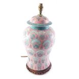 A late Chinese porcelain lamp base, decorated with a design of peacocks on a pink ground, 56cm high.
