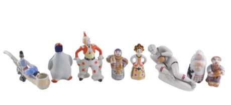 A collection of USSR and Russian porcelain, comprising seated figure of a goal keeper, penguin decan