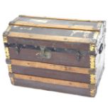 A canvas and wooden slatted trunk, with brass effect and ebonised iron mounts, 69cm wide. (AF)