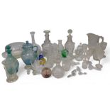 A quantity of 19thC and later glass, to include decanters, coloured glass floats, stoppers, jugs, et