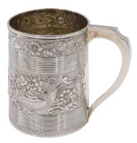 A George III silver mug, of tapered cylindrical form, with stylised handle, with reeded banding, and