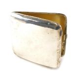 A late Edwardian silver cigarette case, of plain curved design, with silver gilt interior, Chester 1