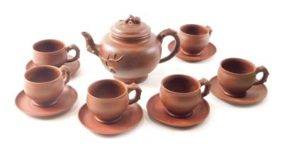 A Chinese redware tea service, comprising tea pot, six cups, six saucers, seal mark to underside