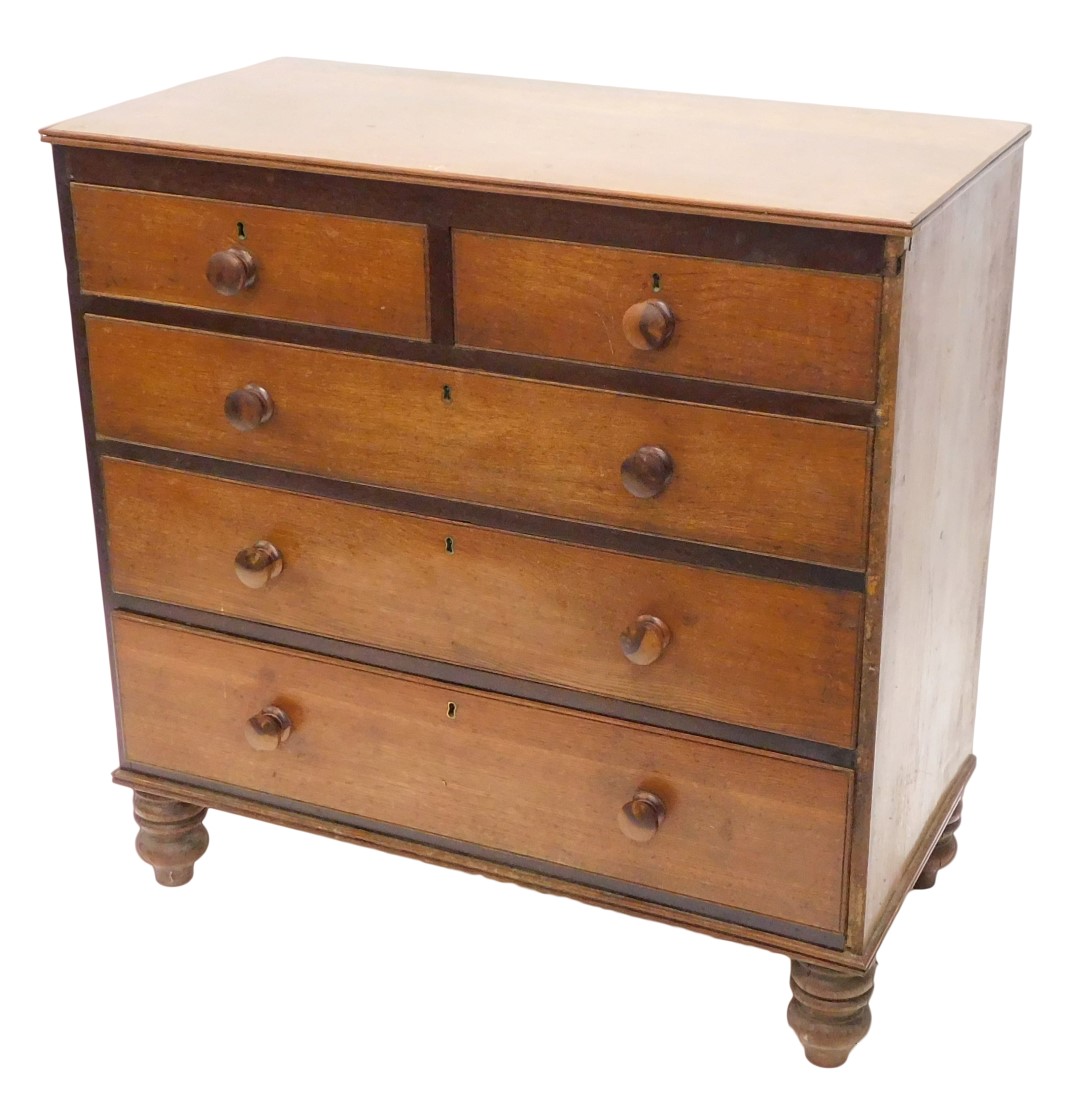 A 19thC oak chest of drawers, the top with a moulded rim above two short and three long drawers, eac