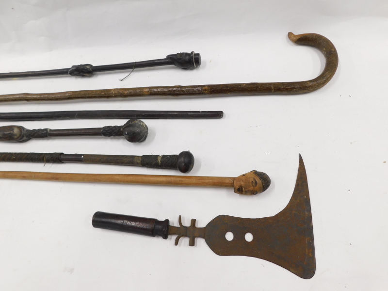 Two African axes or swords, each with a short handle, various tribal walking sticks, etc. - Image 2 of 3