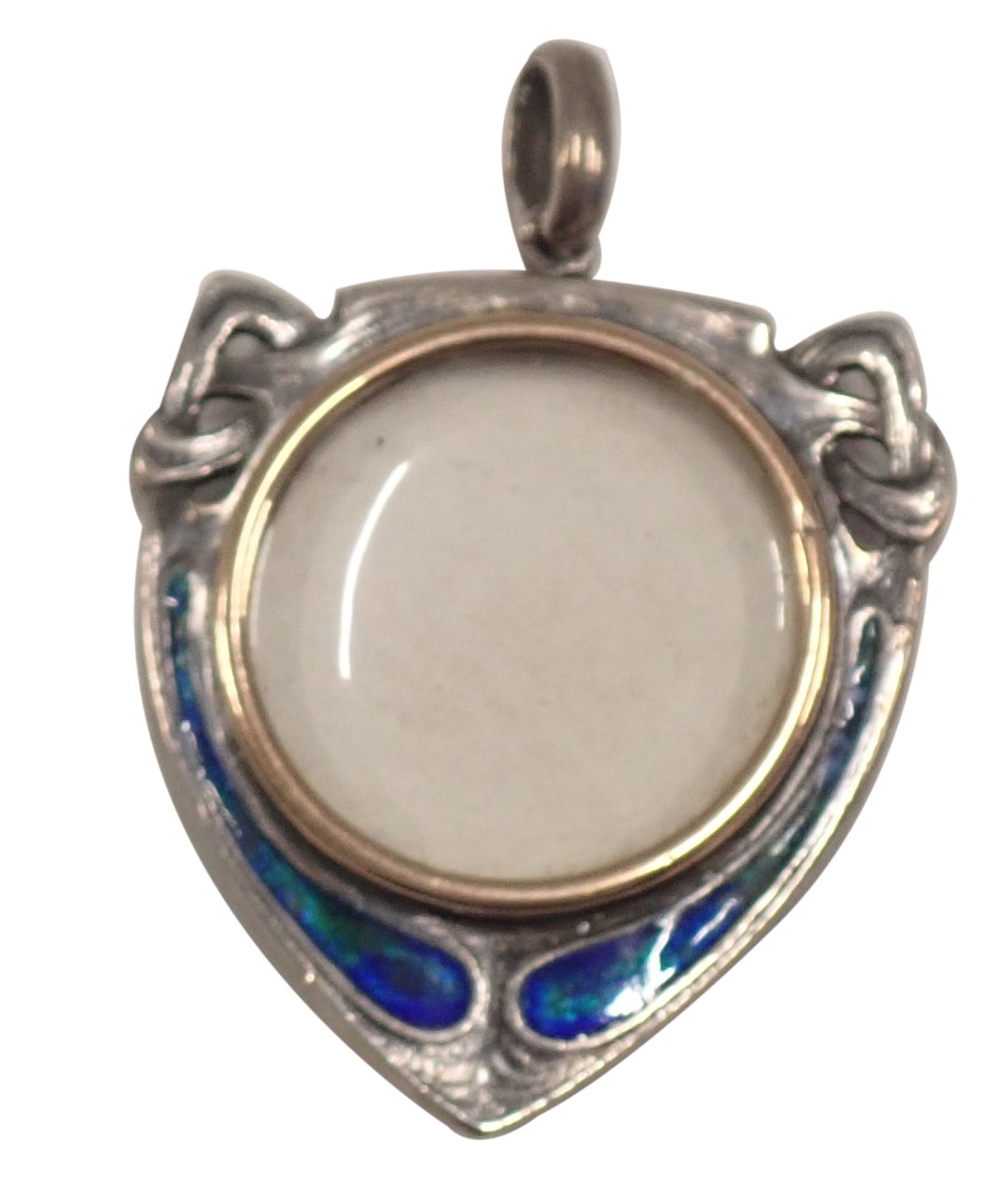 An Art Nouveau shield locket, with a brushed gold central section, in a white metal case set with bl
