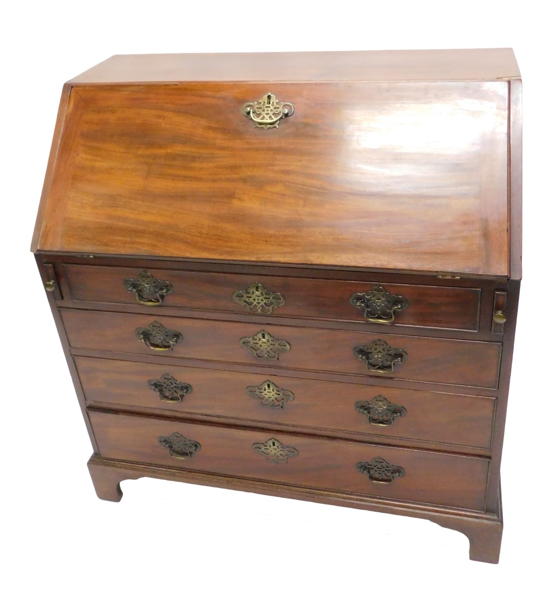 A George III mahogany bureau, the fall with a later brass handle enclosing fitted interior, above fo
