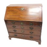 A George III mahogany bureau, the fall with a later brass handle enclosing fitted interior, above fo