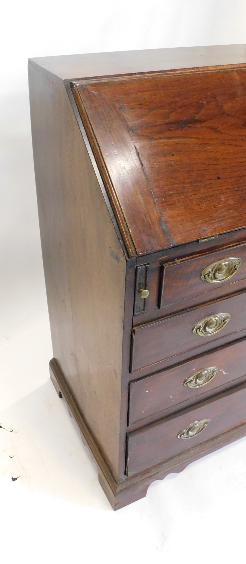 A George III oak bureau, the fall enclosing a fitted interior above four graduated drawers with oval - Image 3 of 3