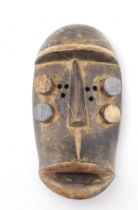 Tribal Art. Grebo/Kru/Krou tribe, a tubular face mask with pin hole eyes, collected from village nea