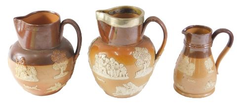 Three Doulton stoneware jugs, comprising one with silver plated collar, 18cm high, and two others, 1