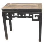 A Chinese ebonised altar table, with a pierced frieze, on shaped legs, 67cm high, 92cm wide.